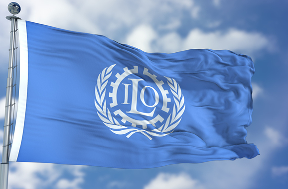 A blue flag with the logo of the ILO in its centre.